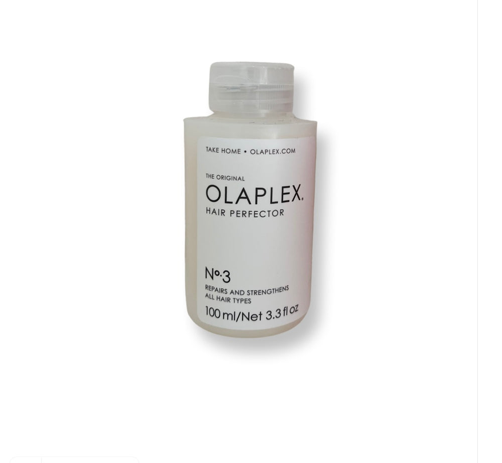 A bottle of Olaplex No3 hair product, with a label that includes the brand name and product description.