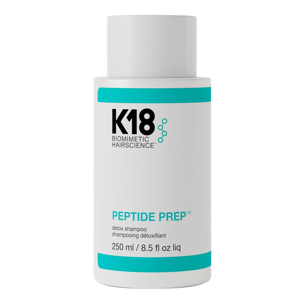 A bottle of K18 Biometric Hair Science Peptide Prep Detox Shampoo in packaging that includes branding and product information.