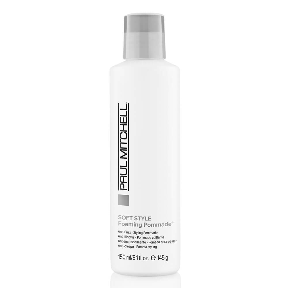 A bottle of Paul Mitchell Soft Style Foaming Pomade. The bottle is white with a grey label and Paul Mitchell branding.